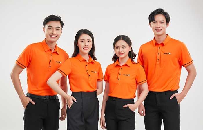 Áo polo đồng phục Kim Anh với màu cam bắt mắt