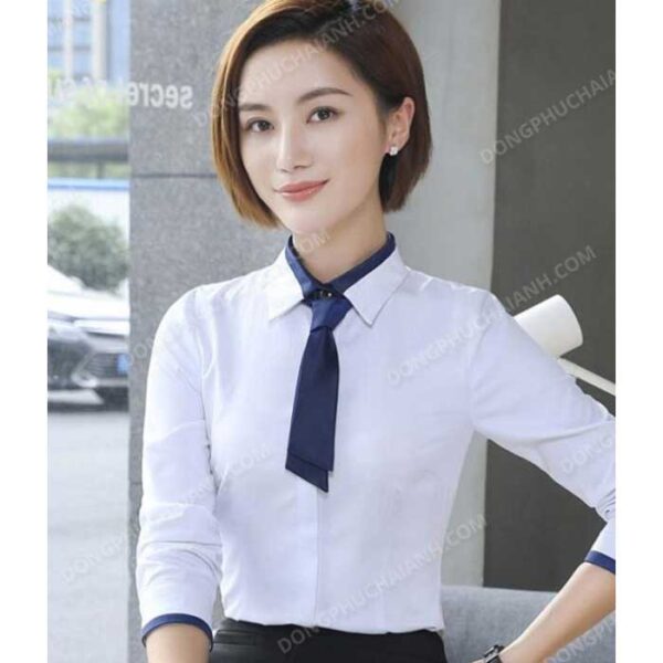 Đồng phục áo sơ mi nữ công sở màu trắng cổ cravat thanh lịch là item thời trang được nhiều cô nàng công sở lựa chọn.