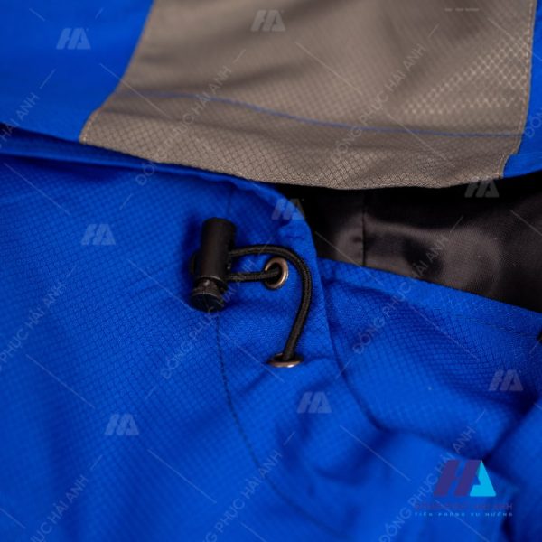 Chất liệu áo khoác gió đồng phục xanh phối ghi- Đồng phục Hải Anh