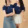Áo đồng phục công ty Ultimate màu xanh đen phối màu be